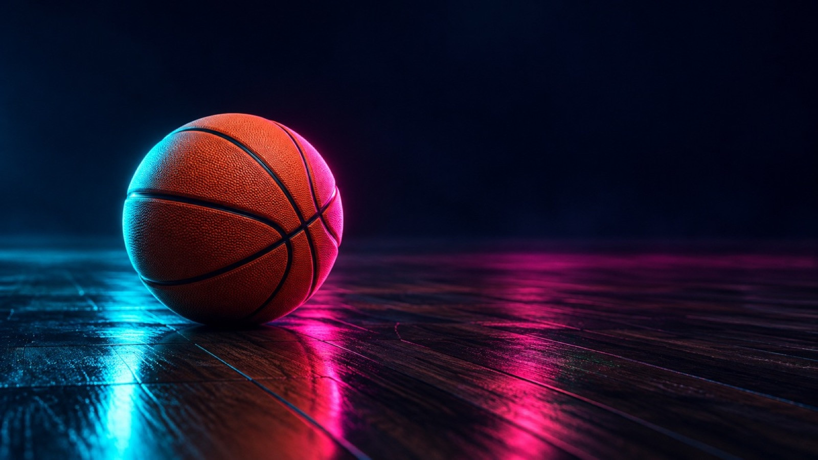 A plain basketball rests on a dark empty hardwood court.
