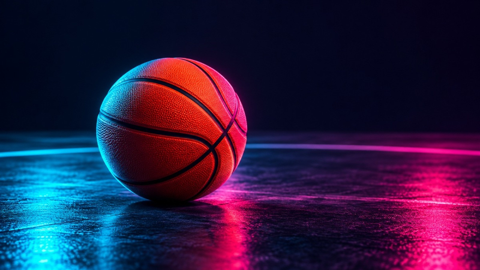 An unbranded orange basketball rests on a dark court.